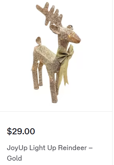 Christmas decoration of a gold, sparkly reindeer figurine. A gold bow is tied around its neck. The text says $29.00. JoyUp LightUp Reindeer - Gold.